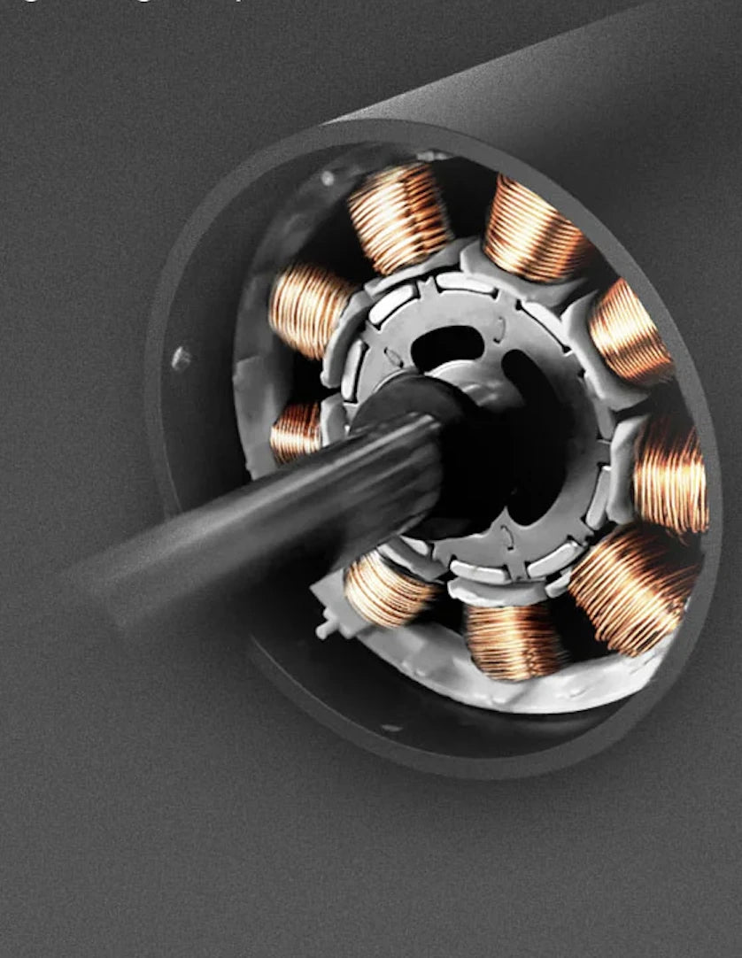 Close-up of an electric motor's stator with copper coils on a dark background